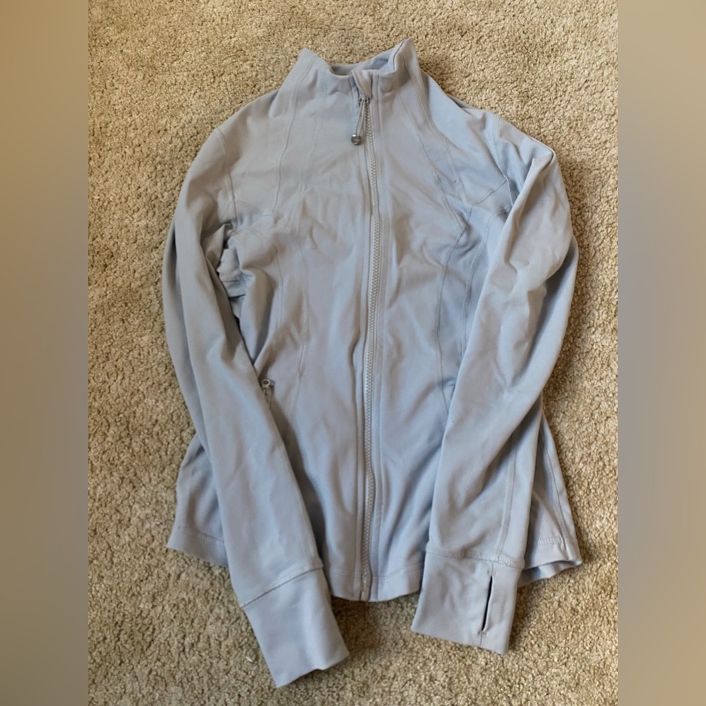 gray zip up jacket
